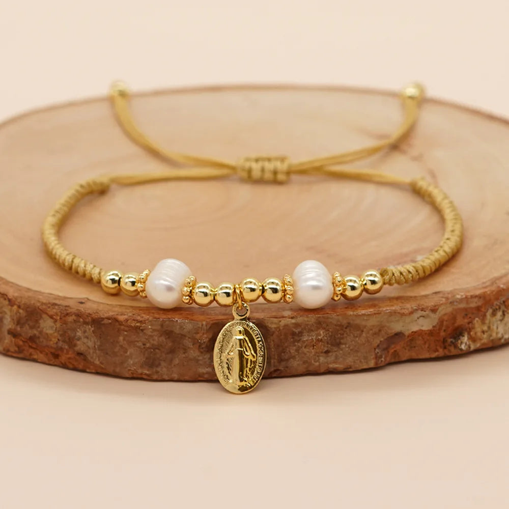 Freshwater pearls bracelet with lucky Jesus pendant